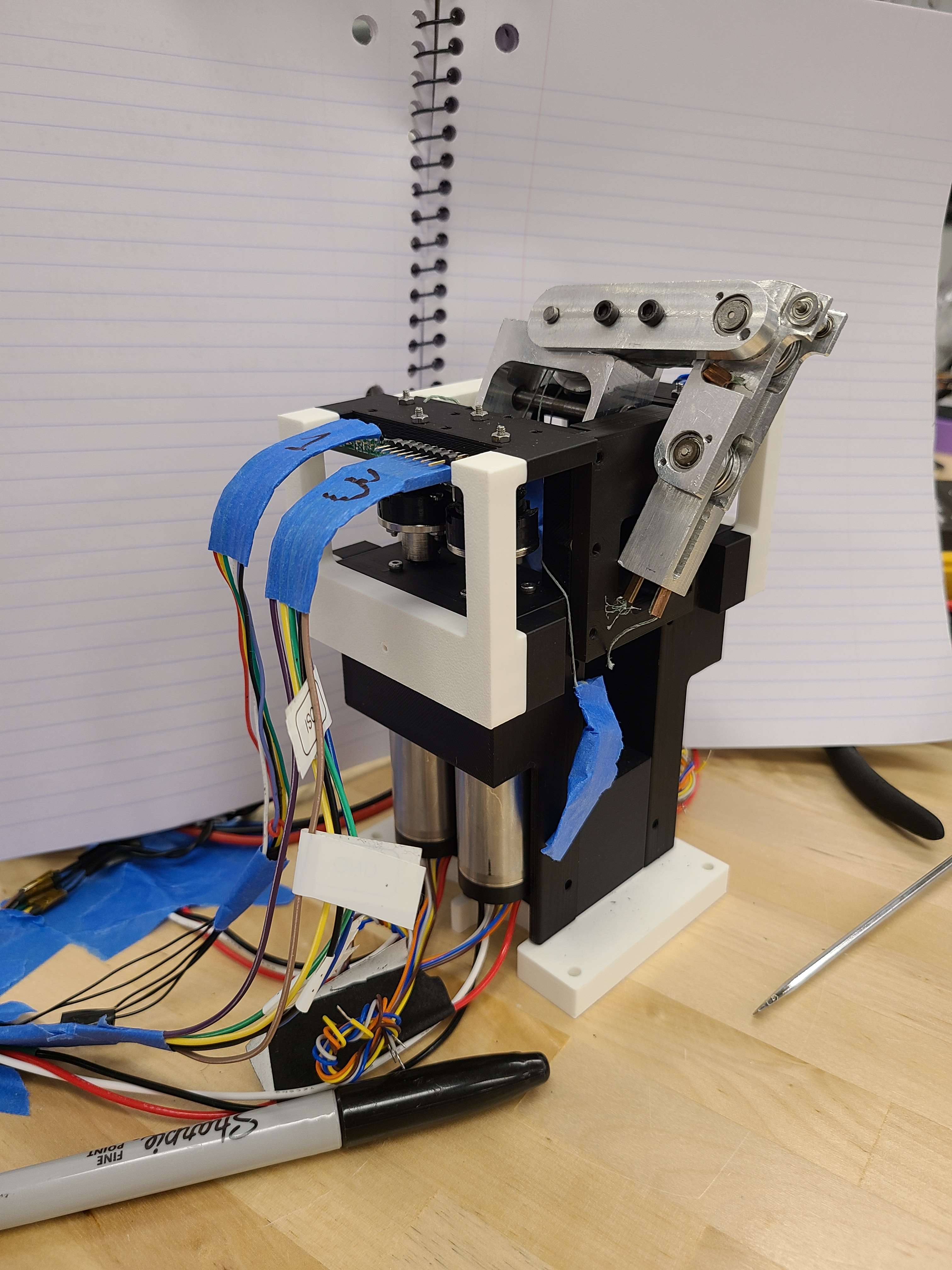 Tendon-driven robotic finger mounted on motor assembly